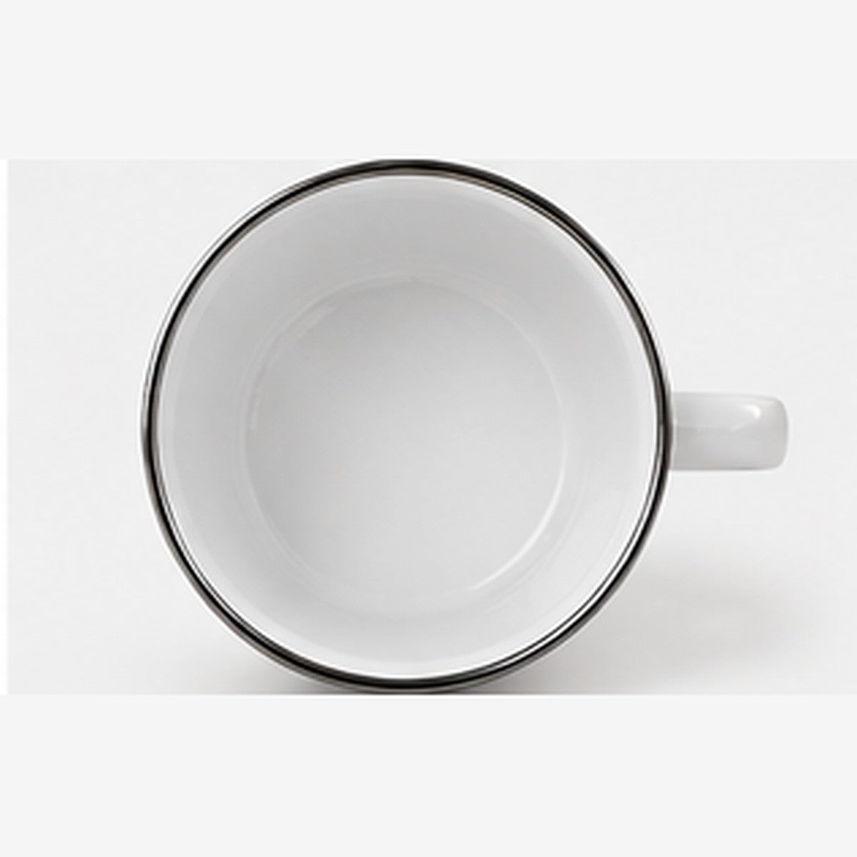 Top view of white enamel mug interior with silver rim