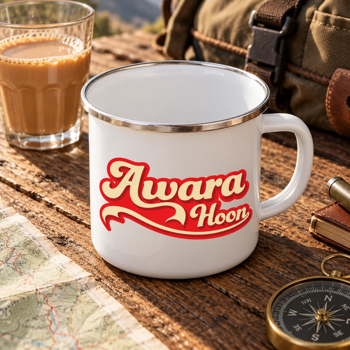 Angled view showing the white interior and silver rim of the Awaara Hoon enamel mug