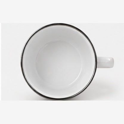 Top view of white enamel mug interior with silver rim