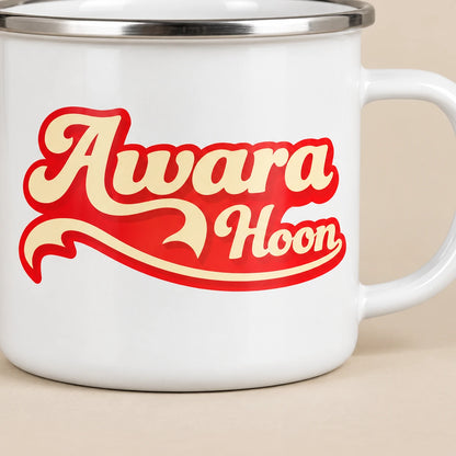 Close-up of the Awaara Hoon enamel mug's cream script and red swirl design without a black sticker contour
