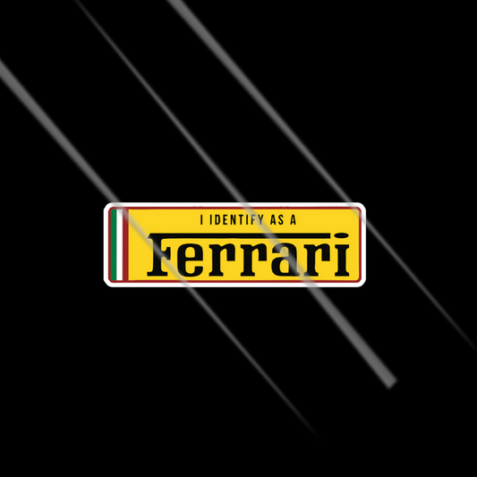 Yellow rectangular sign with 'I Identify as a Ferrari' text on a black background