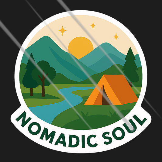 Sticker with a tent, mountains, and river, featuring the text 'Nomadic Soul' on a black background.
