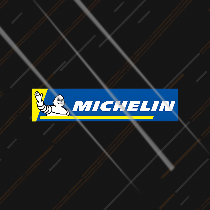 Michelin sticker on a black background with tire tread pattern