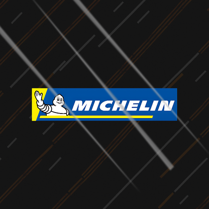 Michelin sticker on a black background with tire tread pattern