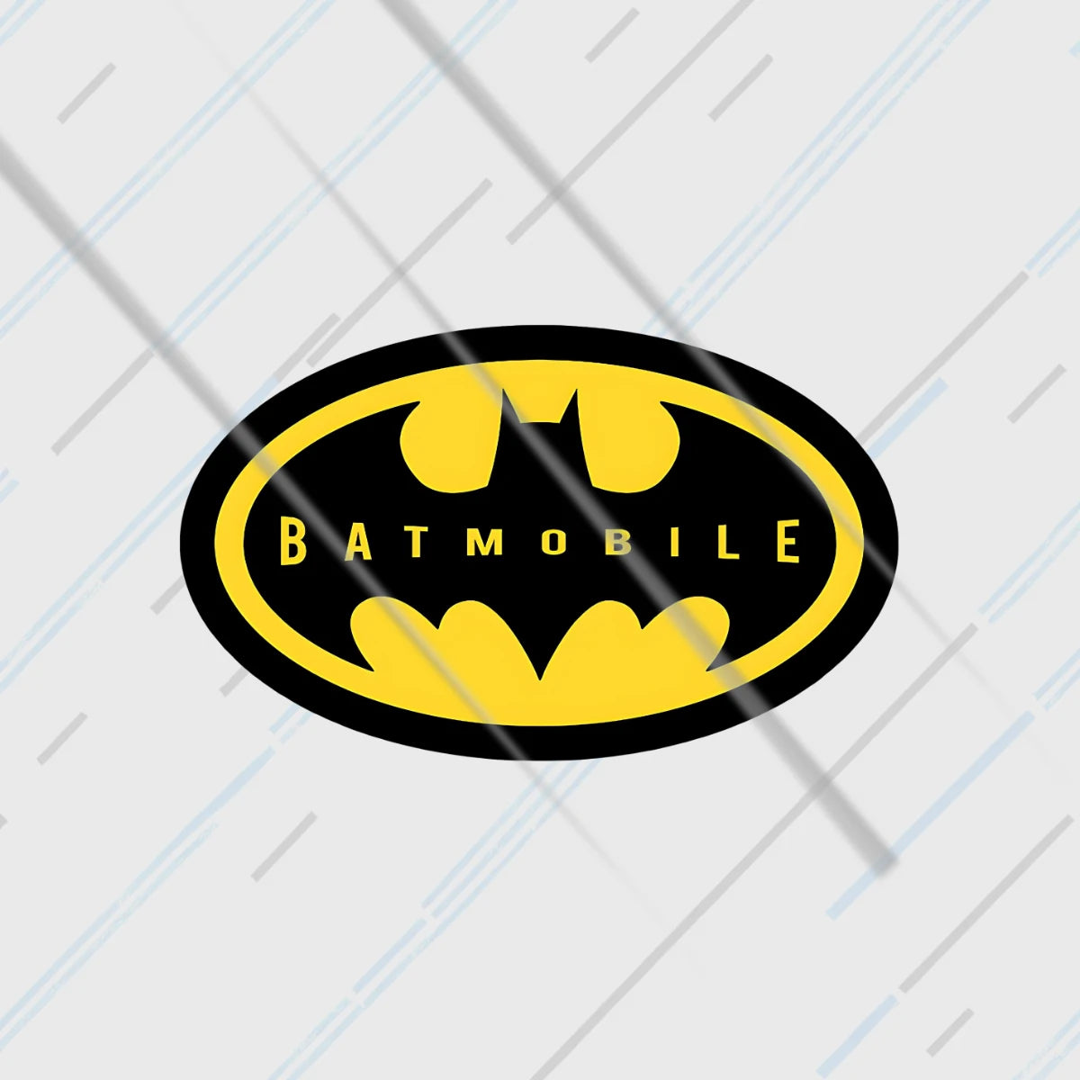Batmobile Batman oval yellow-on-black sticker 3 inch in matte vinyl