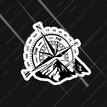 Compass and mountains reflective sticker 3 inch glowing under headlights at night