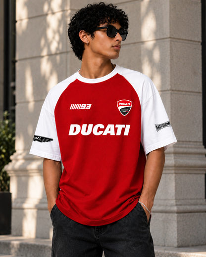 Front view of a model wearing the red Ducati oversized T-shirt with white raglan sleeves, Corse badge and 93 graphic
