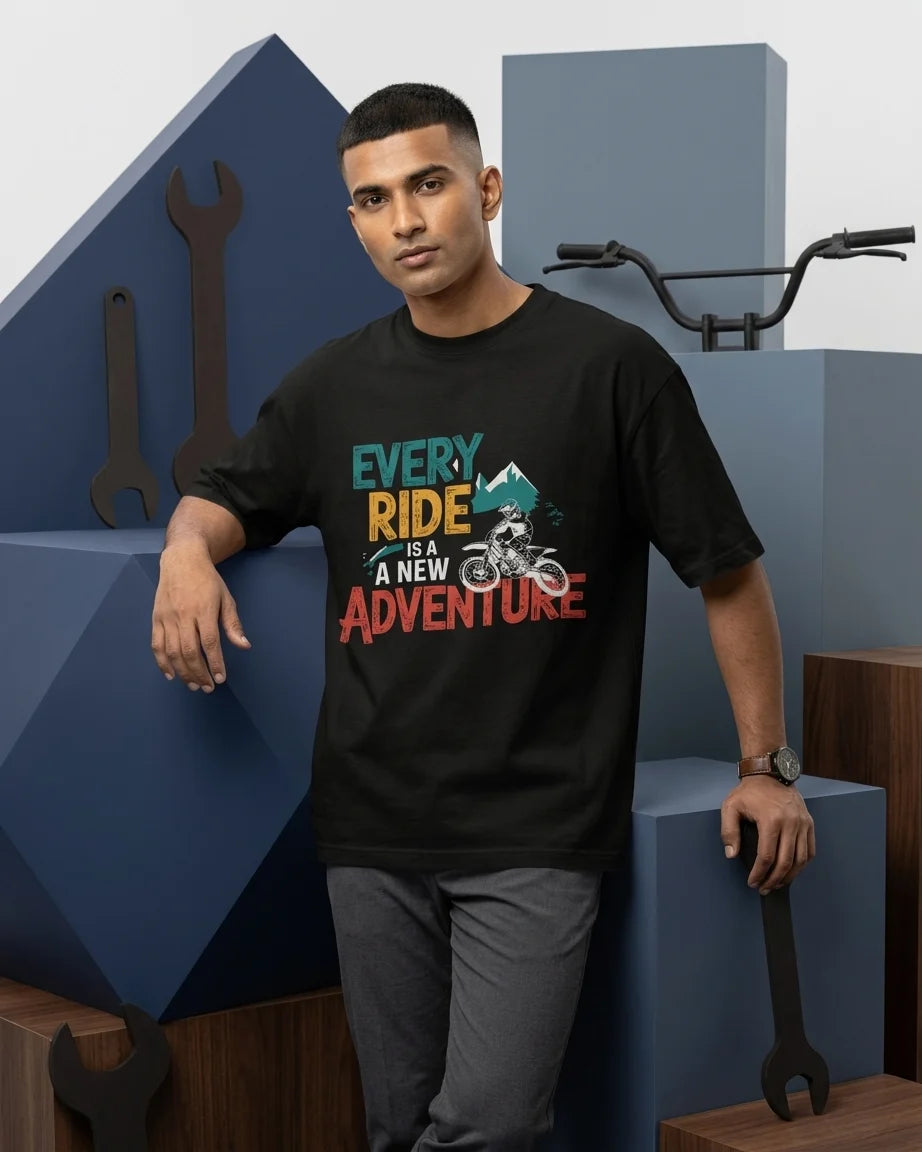 Every Ride Is A New Adventure black oversized t-shirt on male model with dirtbike rider graphic