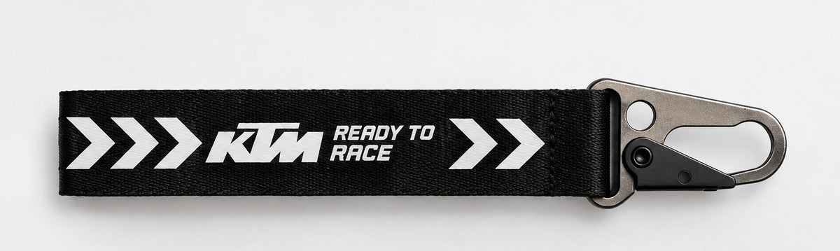 KTM Ready To Race reflective bike keychain black woven fabric with racing arrows and metal clasp