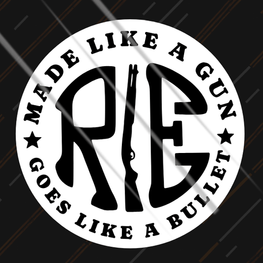 Made Like A Gun badge reflective sticker glowing under headlights on classic motorcycle
