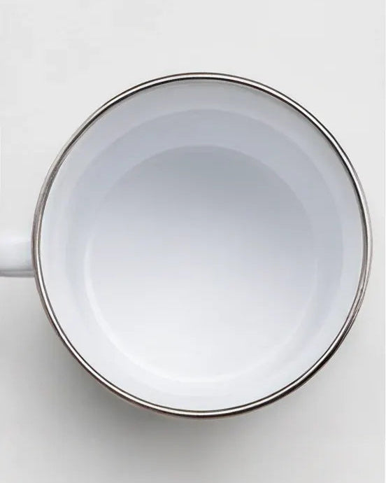 Top view of Om Mani Padme Hum enamel mug showing white interior and stainless steel rim