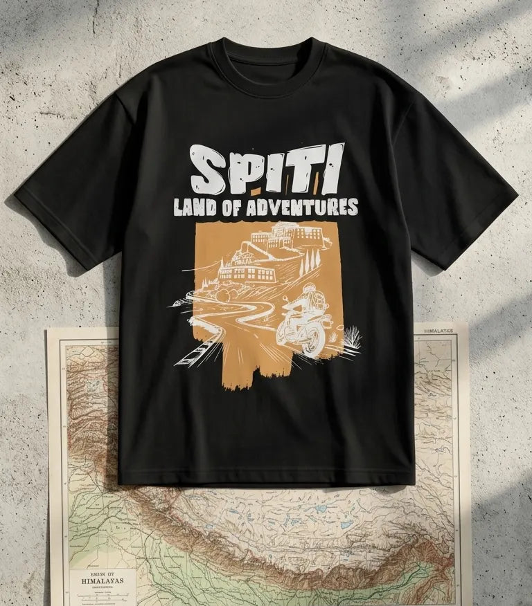 Spiti Land of Adventures black oversized t-shirt flat lay with vintage Himalayas map
