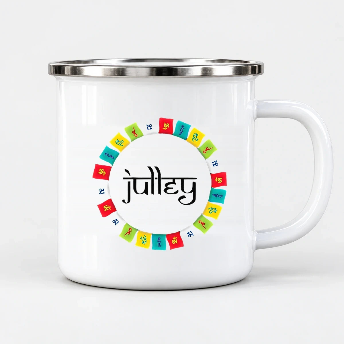 Front studio view of white 300 ml enamel camping mug with circular Himalayan prayer flags artwork and black Hindi lettering