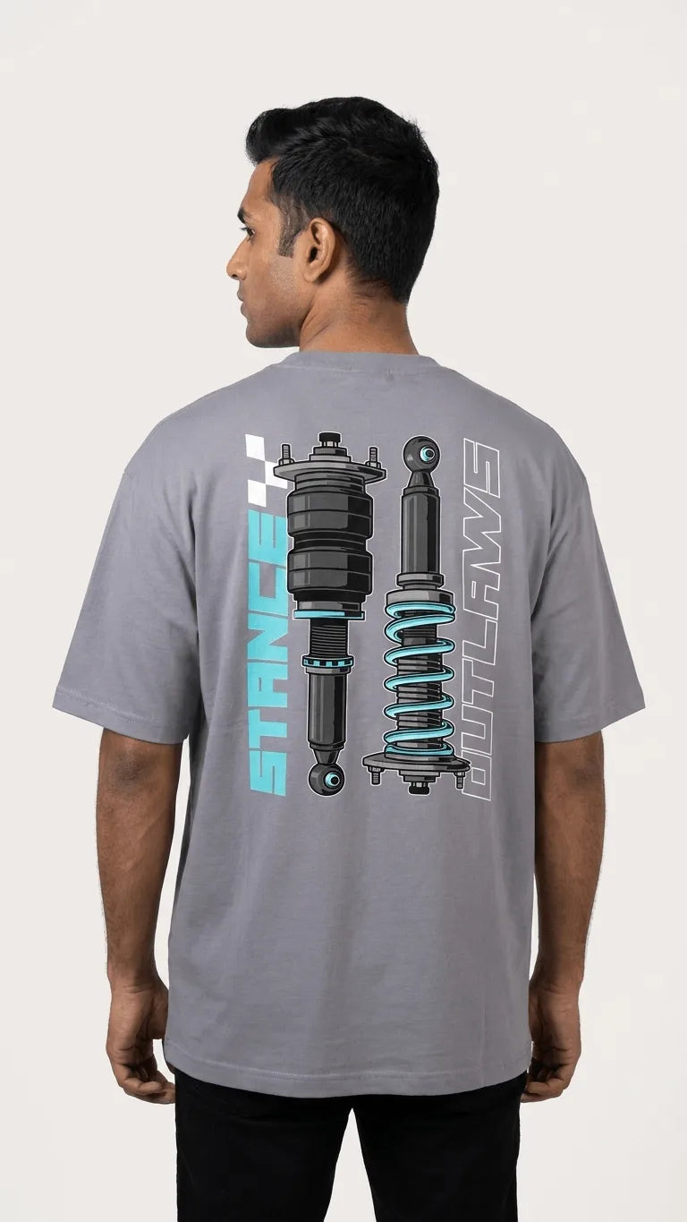 Indian male model wearing Stance Outlaws coilover tee back view, oversized drop-shoulder biker streetwear